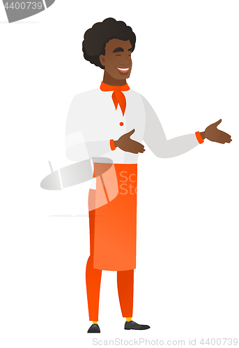 Image of Young african-american happy chef cook gesturing.
