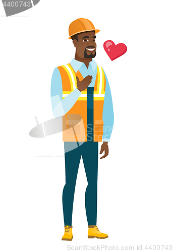 Image of African-american builder holding hand on his chest