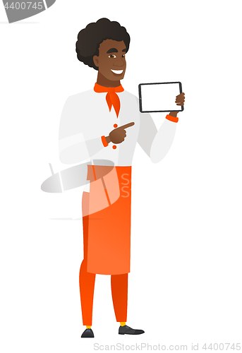 Image of Smiling chef cook holding tablet computer.