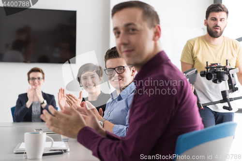 Image of Group of young people meeting in startup office