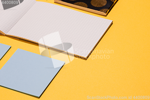 Image of The many notebooks on colored table. memo and planning concept.