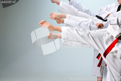 Image of The studio shot of group of kids training karate martial arts