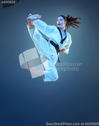 Image of The karate girl with black belt