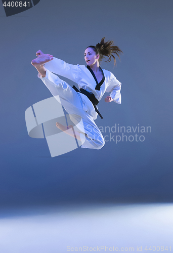 Image of The karate girl with black belt