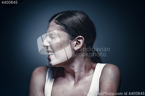 Image of Close up portrait of a crying woman with bruised skin and black eyes