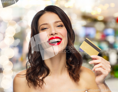 Image of beautiful woman with red lipstick and credit card