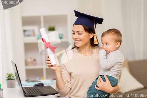 Image of mother student with baby boy and diploma at home