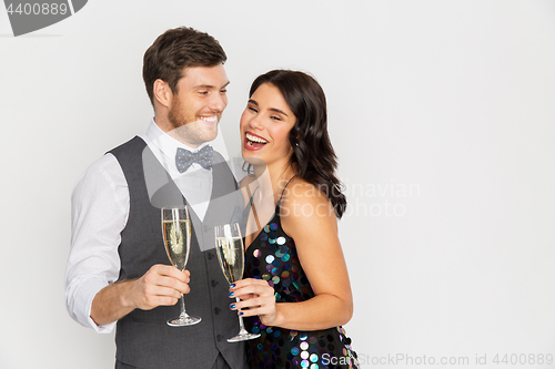 Image of happy couple with champagne glasses at party