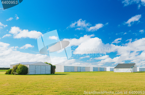 Image of Metallic warehouse with blue sky