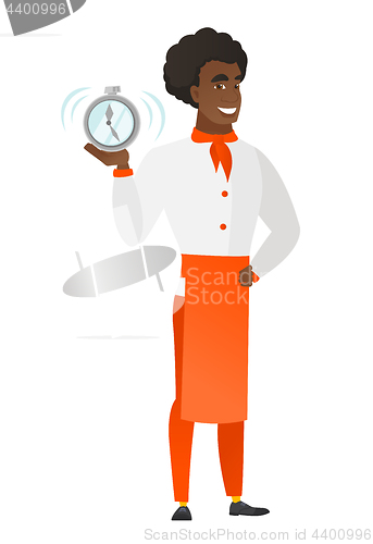 Image of African-american chef cook holding alarm clock.
