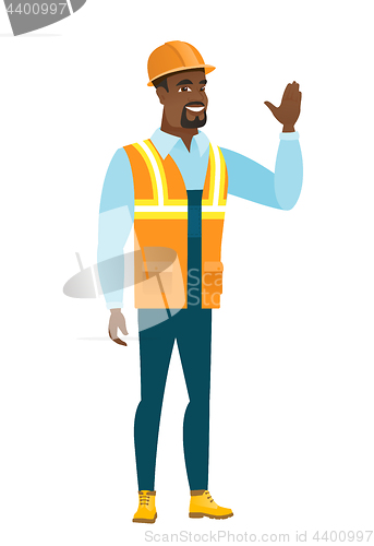 Image of Young african-american builder waving his hand.