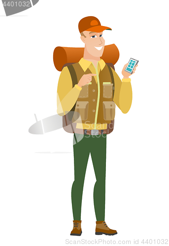 Image of Caucasian traveler holding a mobile phone.