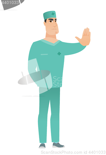 Image of Caucasian doctor showing stop hand gesture.