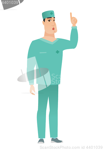 Image of Doctor with open mouth pointing finger up.