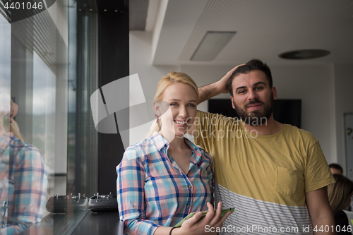 Image of Business People Working With Tablet in startup office