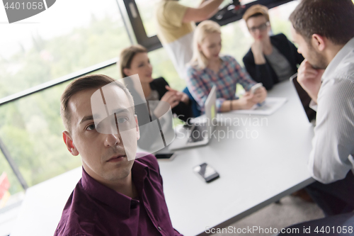 Image of Group of young people meeting in startup office