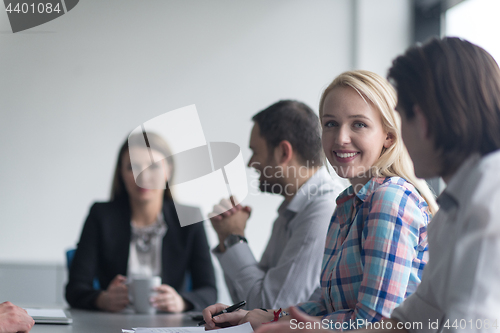 Image of Group of young people meeting in startup office