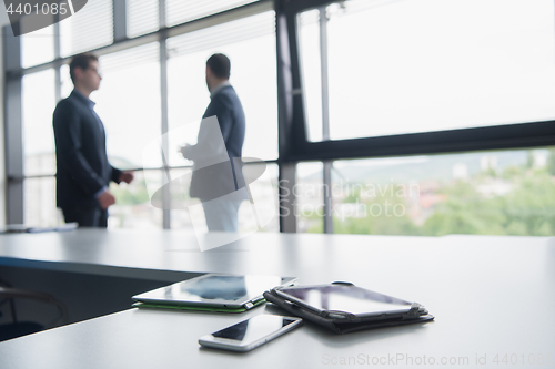 Image of cloasing the deal in modern office interior