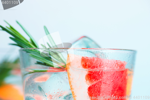 Image of closeup of a cape cod cocktail or vodka cranberry on a blue background