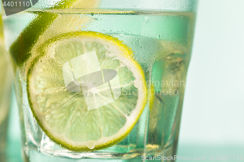 Image of closeup of a cape cod cocktail or vodka cranberry on a blue background