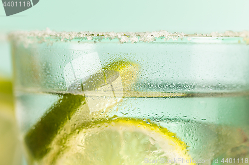 Image of closeup of a cape cod cocktail or vodka cranberry on a blue background