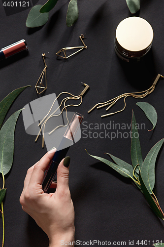 Image of Woman accessories on black, top view