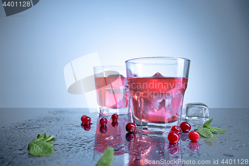 Image of closeup of a cape cod cocktail or vodka cranberry on a blue background