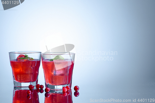 Image of closeup of a cape cod cocktail or vodka cranberry on a blue background