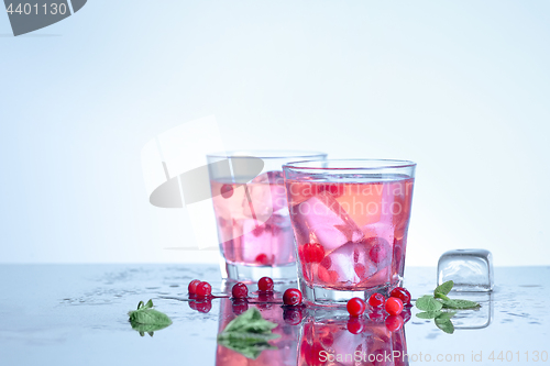 Image of closeup of a cape cod cocktail or vodka cranberry on a blue background