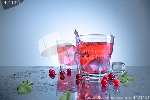 Image of closeup of a cape cod cocktail or vodka cranberry on a blue background