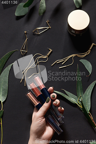 Image of Woman accessories on black, top view