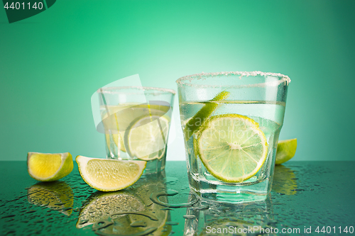 Image of closeup of a cape cod cocktail or vodka cranberry on a blue background