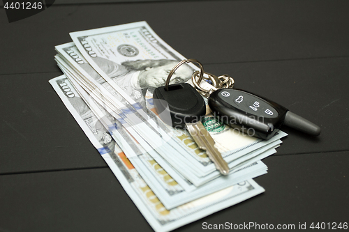 Image of Heap of money and car key