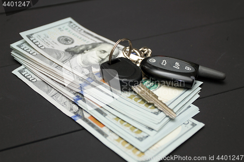 Image of Heap of money and car key