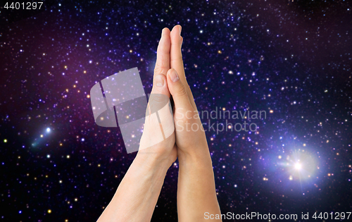 Image of close up of senior and young woman touching hands