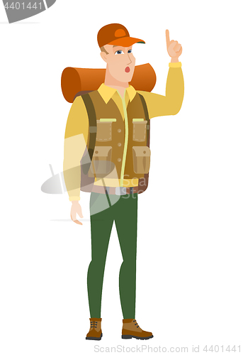 Image of Traveler with open mouth pointing finger up.