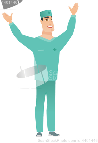 Image of Surgeon standing with raised arms up.