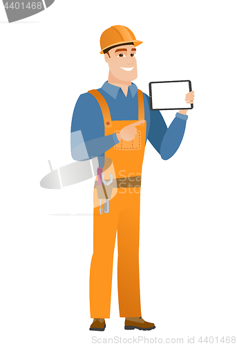 Image of Smiling builder holding tablet computer.