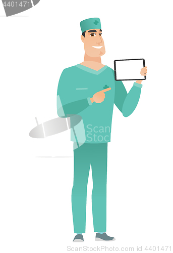 Image of Smiling doctor holding tablet computer.