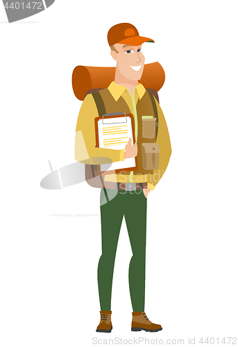 Image of Traveler holding clipboard with papers.