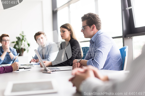 Image of Business Team At A Meeting at modern office building