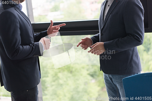 Image of cloasing the deal in modern office interior