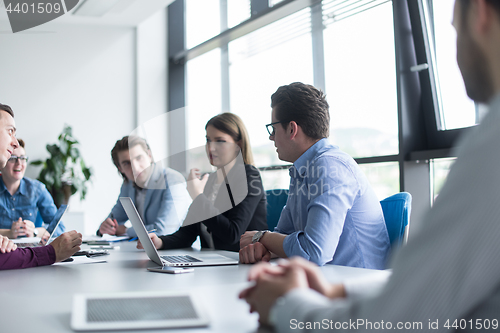 Image of Business Team At A Meeting at modern office building