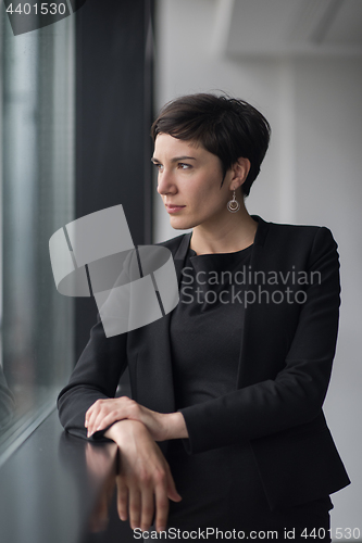 Image of Portrait of successful Businesswoman by the window