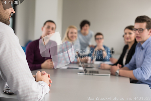 Image of Business Team At A Meeting at modern office building