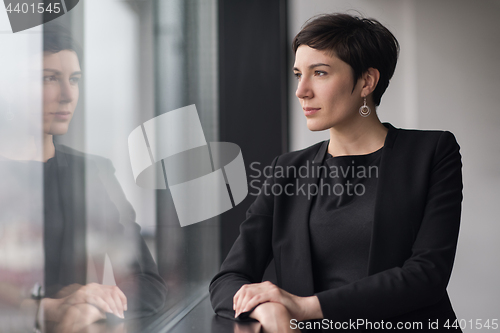 Image of Portrait of successful Businesswoman by the window