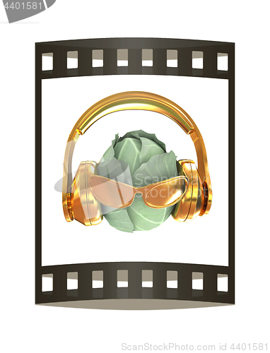 Image of Green cabbage with sun glass and headphones front \"face\" on a wh