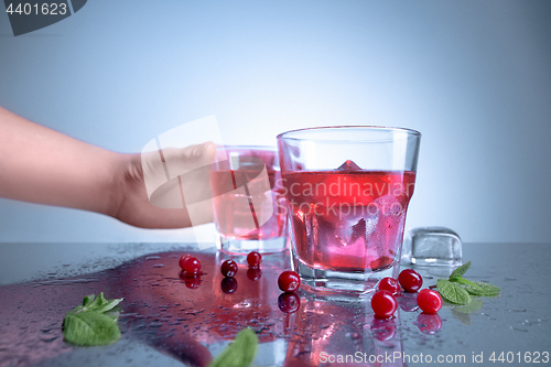 Image of closeup of a cape cod cocktail or vodka cranberry on a blue background