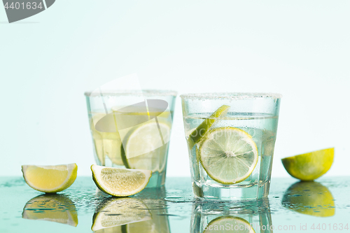 Image of closeup of a cape cod cocktail or vodka cranberry on a blue background