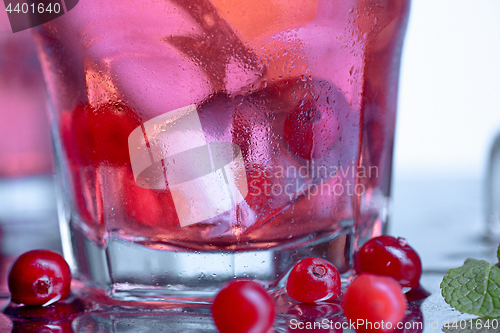 Image of closeup of a cape cod cocktail or vodka cranberry on a blue background